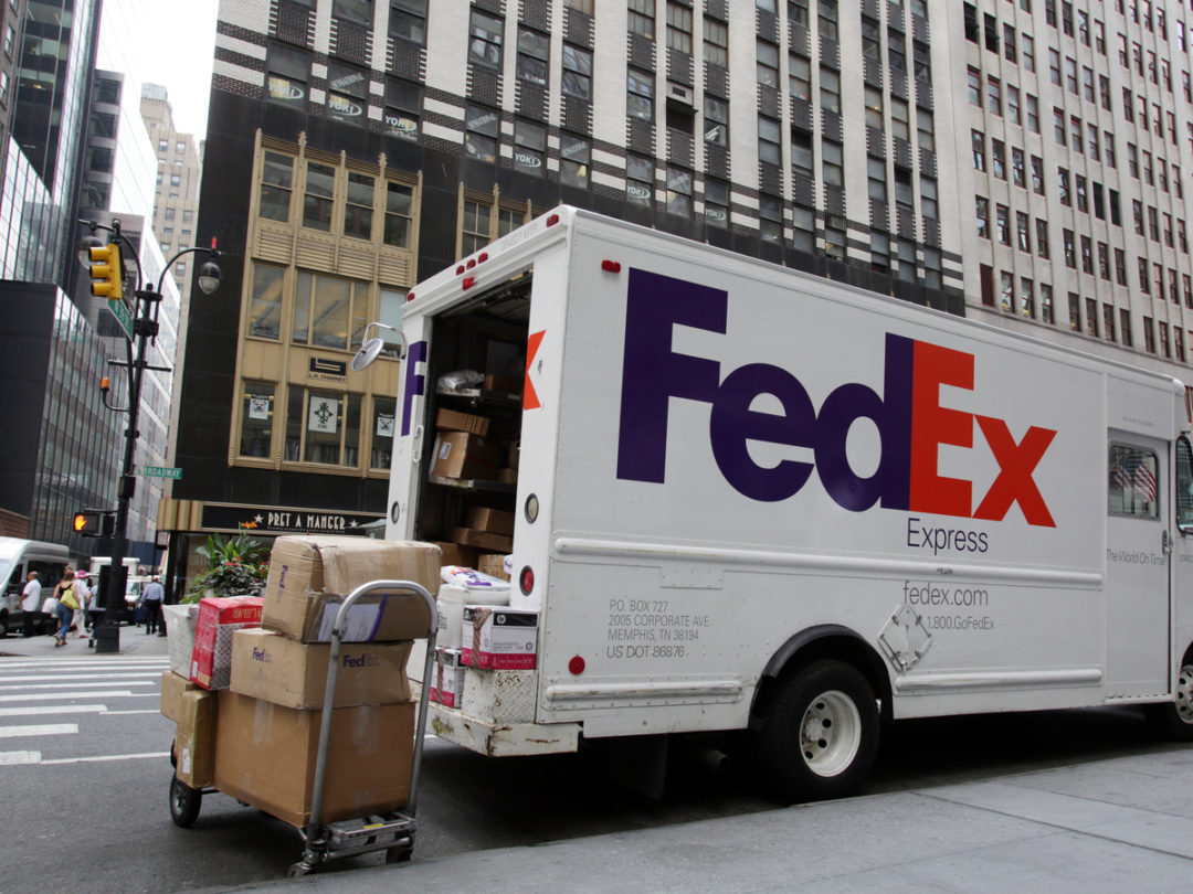 Packages are unloaded from a FedEx Corp. truck in New York City. 