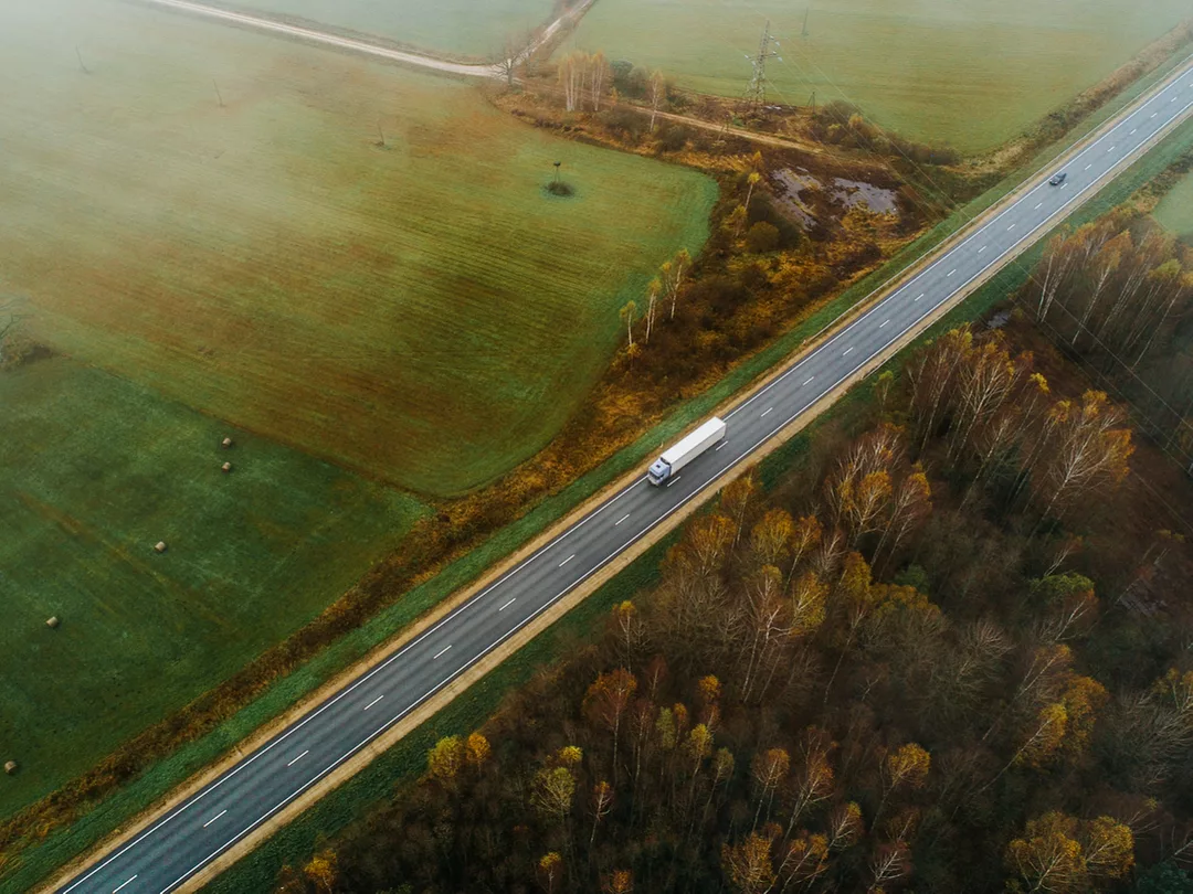 Aerial view of a truck on a highway.