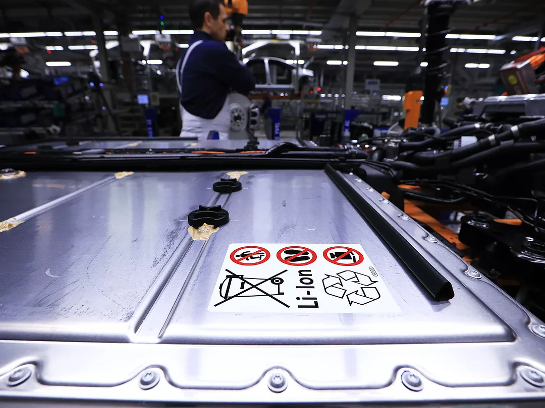 A lithium-ion automotive battery pack sits on a chassis.