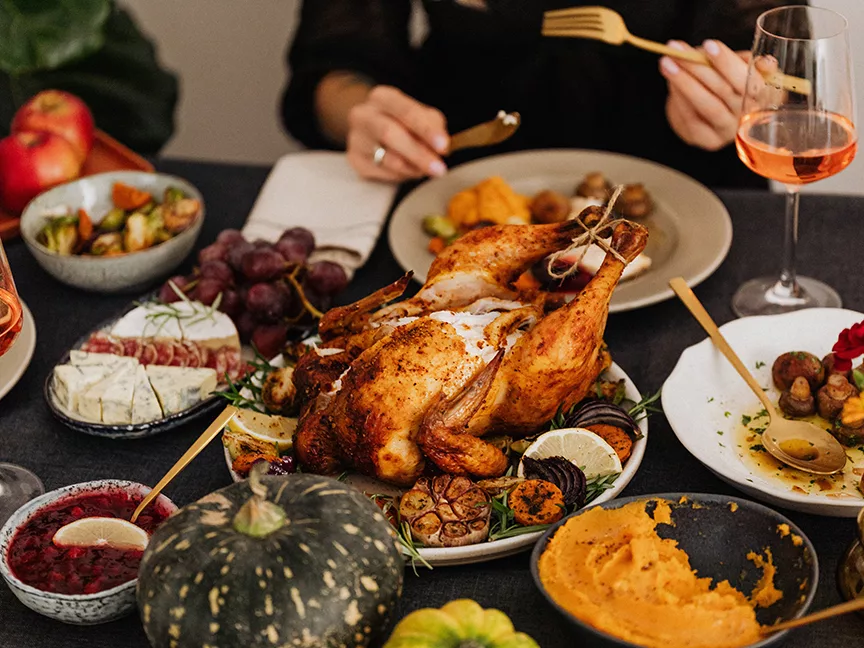 Roasted turkey sits among traditional Thanksgiving Day dishes.