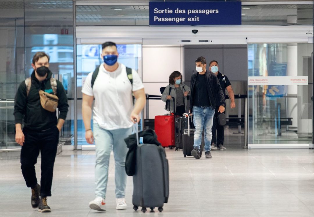 Travelers arrive at Montreal's international in April. Bloomberg