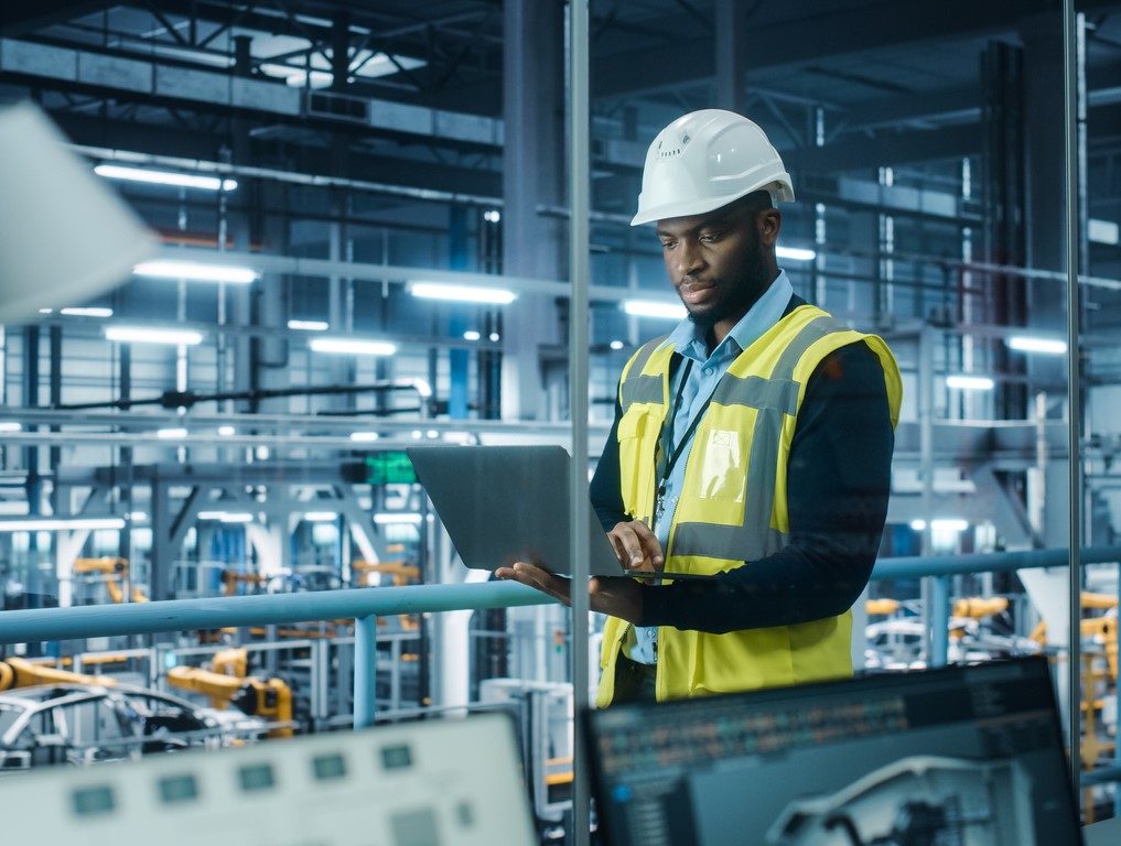  A MAN LOOKS AT A CLIPBOARD IN A MANUFACTURING PLANT INTERIOR iStock-gorodenkoff-1352825038.jpg