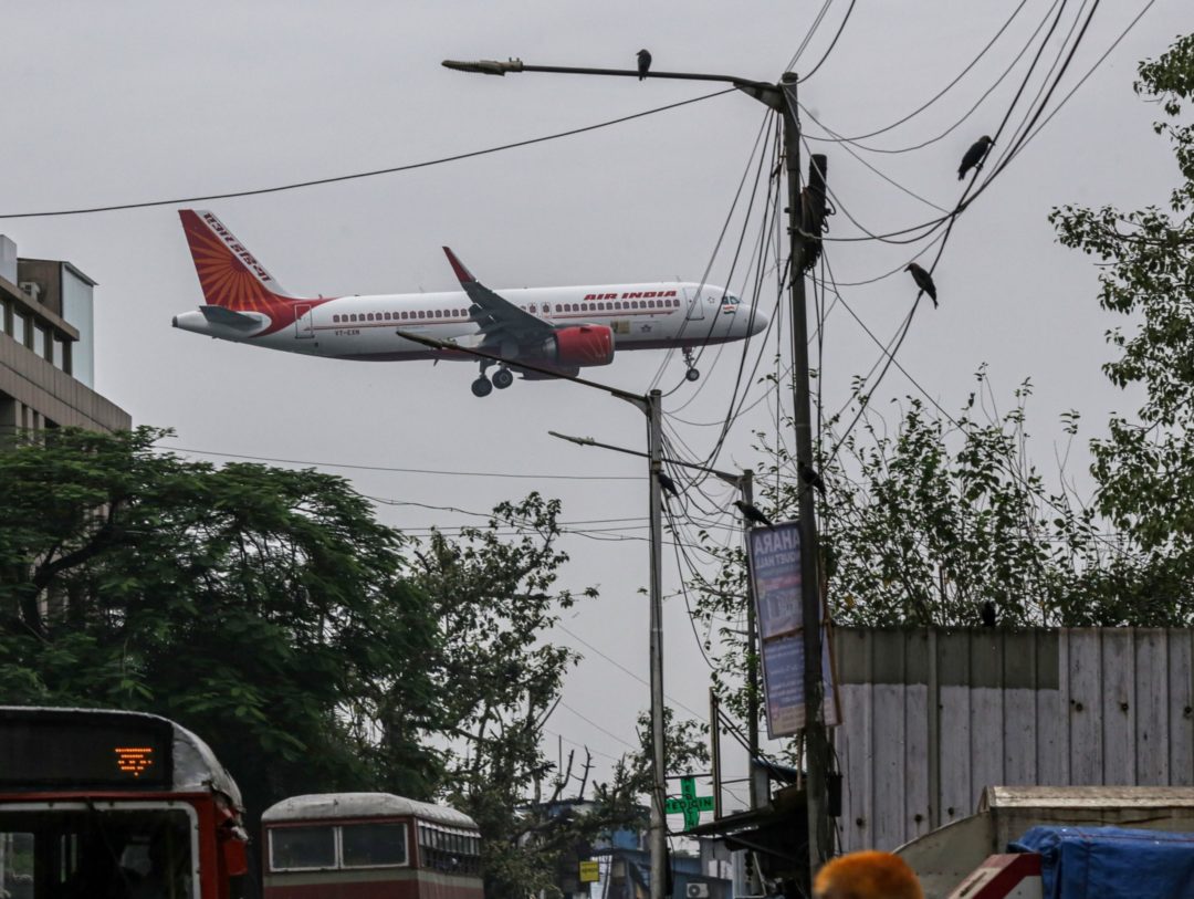 AN AIR INDIA PLANE FLIES OVER AN INDIAN CITY BLOOMBERG.jpg