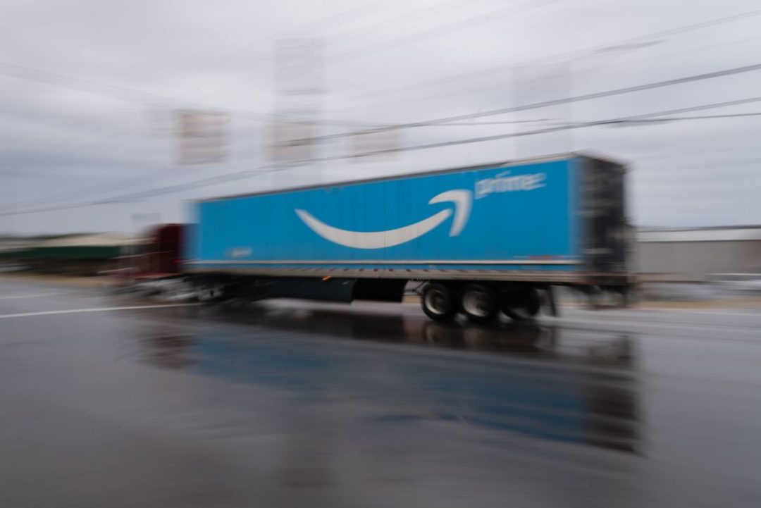 PHOTO OF AN AMAZON TRUCK IN MOTION ON THE ROAD BLOOMBERG.jpg