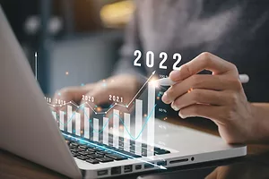 A COMPUTER WITH A GRAPHIC SHOWING FINANCIAL GROWTH
