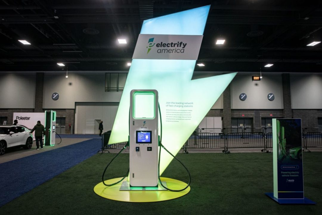 AN ELECTRIFY AMERICA CHARGING STATION SITS IN A SPOTLIGHT