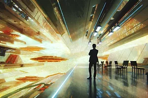 A PERSON STANDS IN A TUNNEL OF DAZZLING LIGHTS