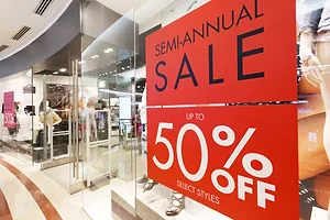 SALE SIGNS ON A STOREFRONT
