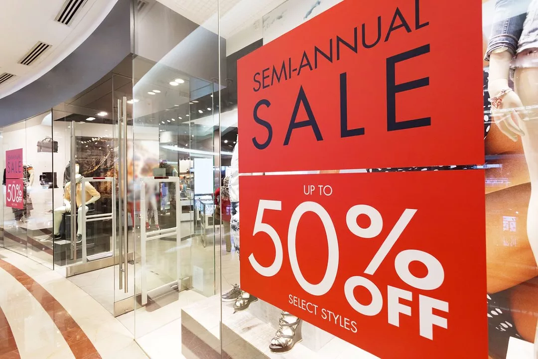 SALE SIGNS ON A STOREFRONT