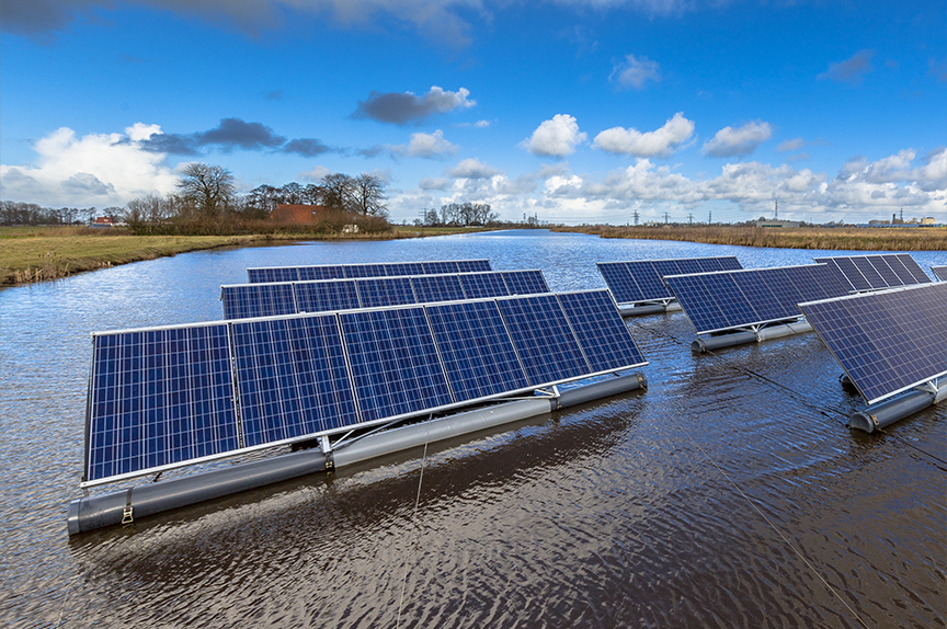 SOLAR PANELS SIT IN A FLOODED FIELD UNDER THE SUN