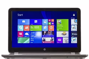 A HEWLETT PACKARD PERSONAL COMPUTER SITS OPEN, SHOWING A HOME SCREEN FULL OF ICONS