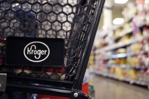 A KROGER SHOPPING CART SITS IN A STORE