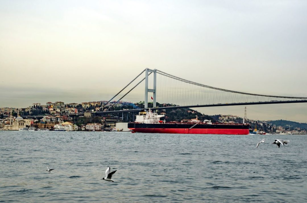 AN OIL TANKER MAKES ITS WAY UNDER A BRIDGE OVER THE BOSPHORUS 