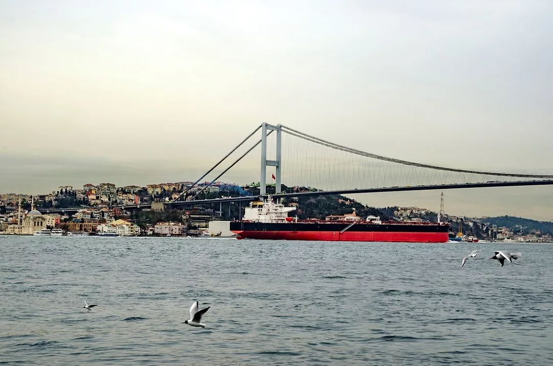 AN OIL TANKER MAKES ITS WAY UNDER A BRIDGE OVER THE BOSPHORUS