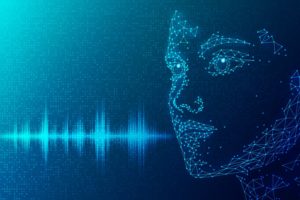 GRAPHIC WITHE THE ELECTRONIC OUTLINE OF A HUMAN FACE AND A VOICE WAVE PATTERNpg