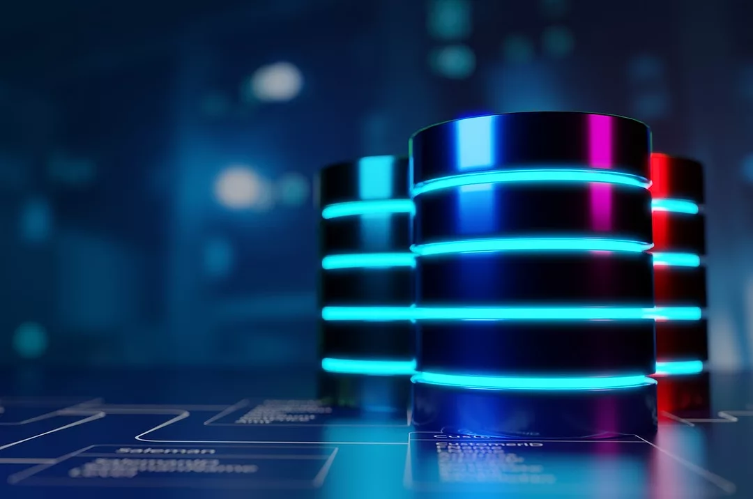 DATA STORAGE STACKS, GLOWING WITH BLUE LIGHTS, SIT ON A SHINY SURFACE