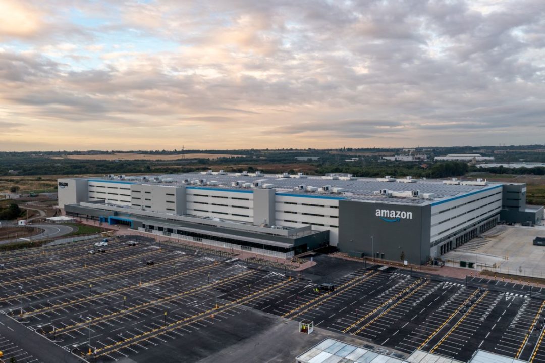AERIAL VIEW OF A LARGE WAREHOUSE SURROUNDED BY TRUCK BAYS