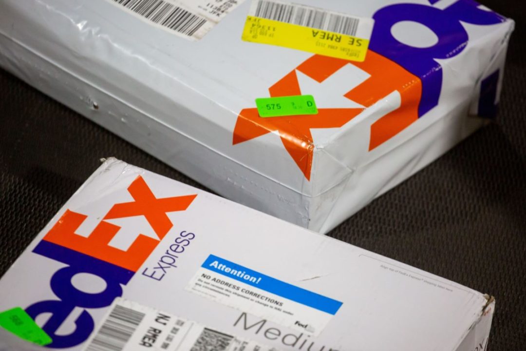 TWO FEDEX PACKAGES SIT ON A TABLE