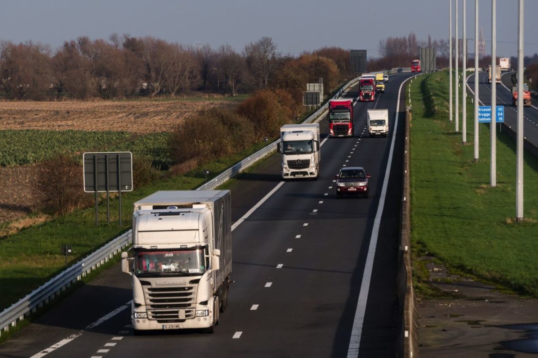 TRUCKS MINGLE WITH CARS ON A EUROPEAN HIGHWAY