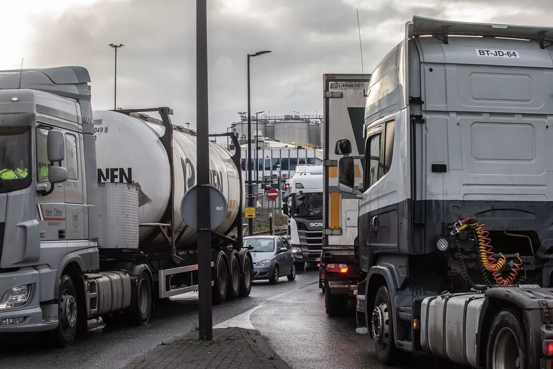 TRUCKS CLUSTERED AT A HIGHWAY STOP