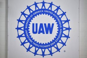 THE BRIGHT BLUE AND WHITE UAW LOGO 