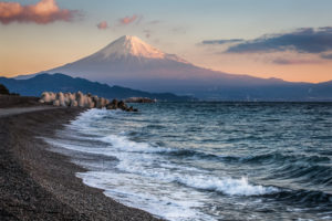 A beach can be seen on a winter morning with Mt. Fuji in the background.