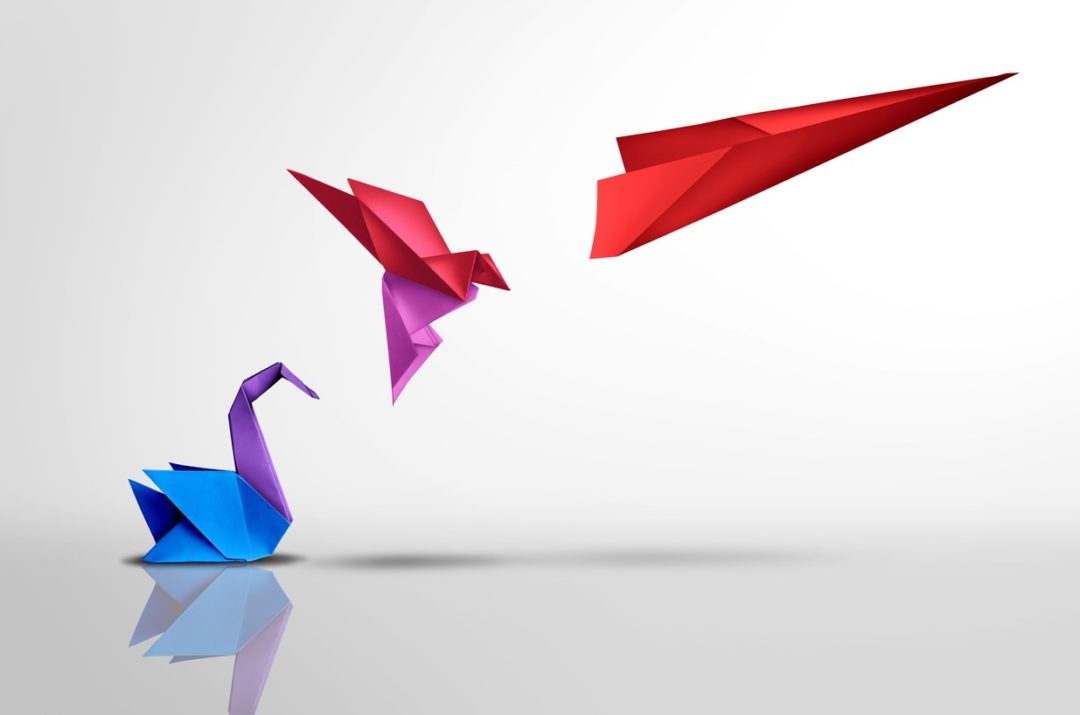 THREE ORIGAMI CREATURES IN SEQUENCE - A SWAN, A BIRD AND A PLANE TAKING FLIGHT