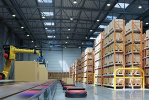 A WAREHOUSE houses a Robotic arm and robots for packing and moving goods