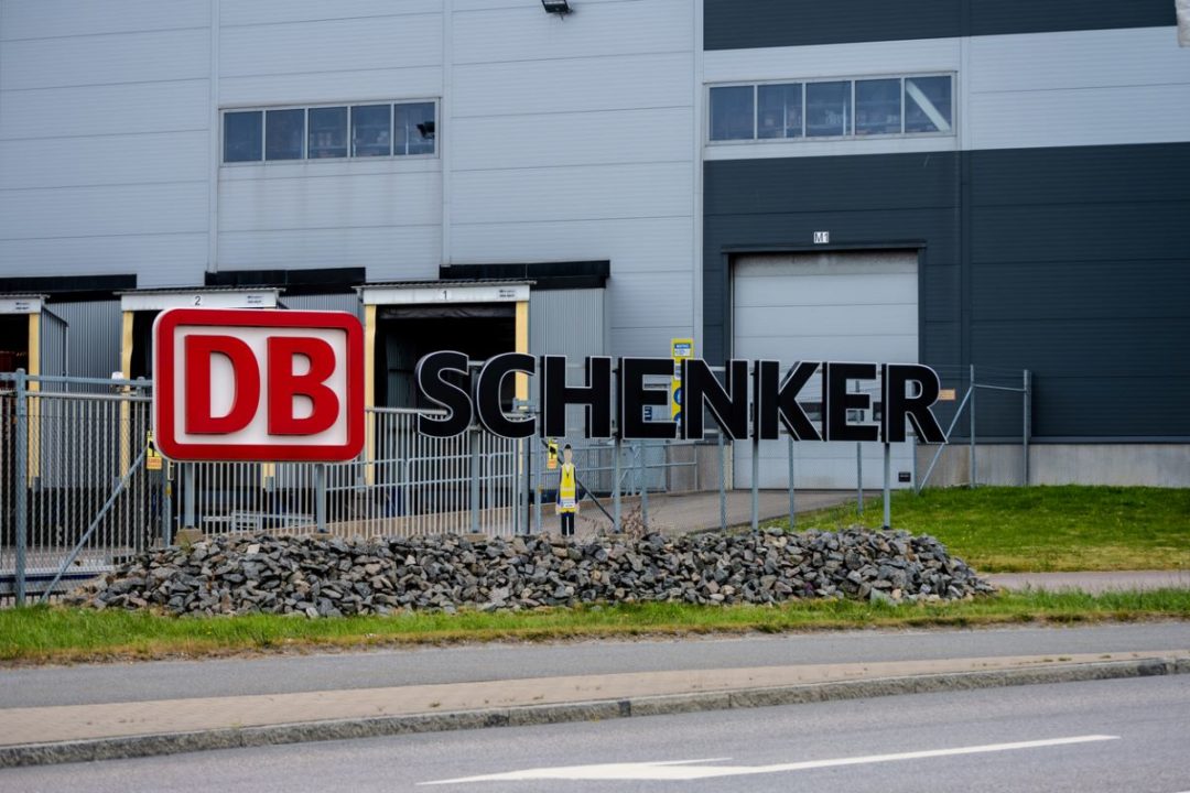 Large DB Schenker sign outside a warehouse