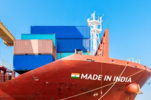 A CONTAINER SHIP'S PROW BEARS THE WORDS, MADE IN INDIA 