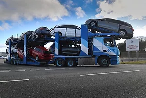 A vehicle transporter leaves the Vauxhall plant in Ellesmere Port, U.K. Photo: Anthony Devlin/Bloomberg