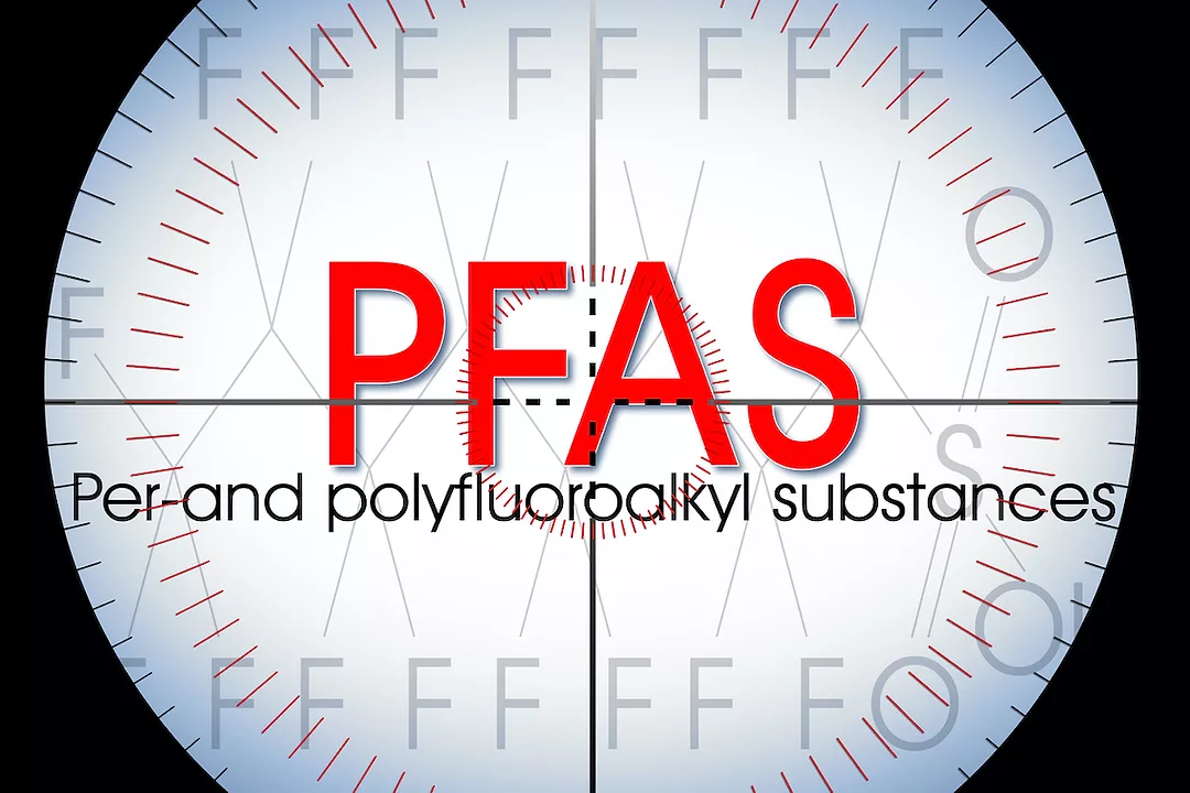 The letters "PFAS" with the words "per- and polyfluoroalkyl substances" are in the center of a visual scope. Photo: iStock.com/Francesco Scatena