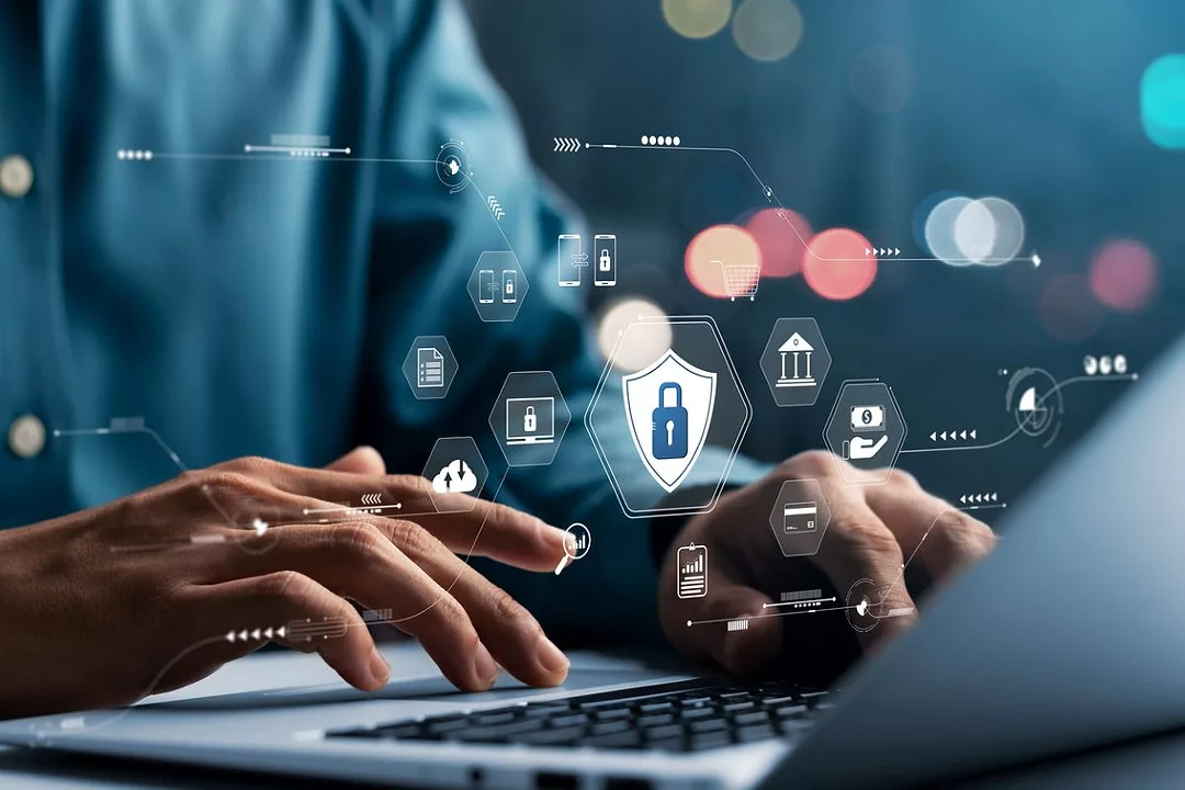 SYMBOLS OF TRADE AND RISK HOVER OVER TWO HANDS TYPING ON A KEYBOARD
