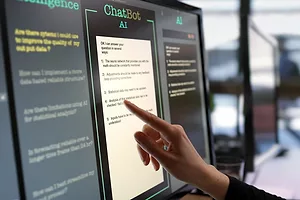 A HAND TOUCHES A SCREEN FULL OF TEXT, WITH THE HEADLINE CHATBOT AI