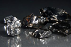 A CLOSE-UP VIEW OF CHUNKS OF SHINY METALLIC SUBSTANCES