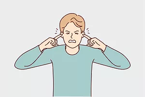 AN ILLUSTRATION DEPICTS AN UNHAPPY MAN WITH HIS EYES CLOSED PLUGGING HIS EARS WITH HIS INDEX FINGERS.