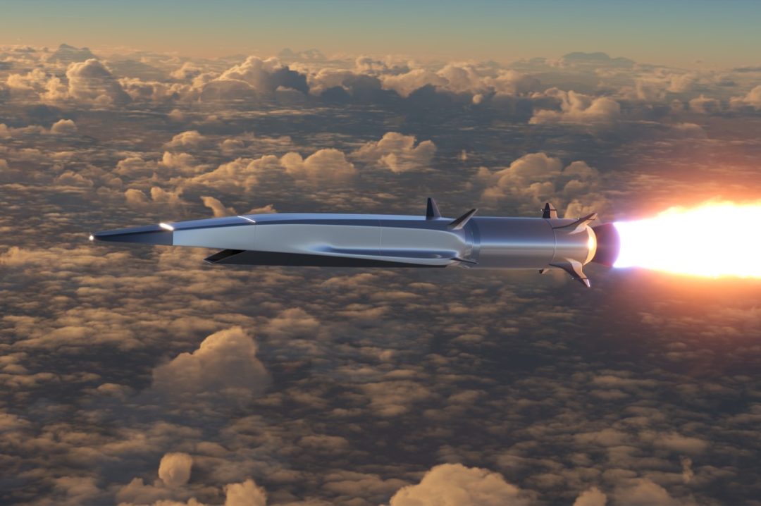 A ROCKET WITH A TAIL OF FLAME FLIES ABOVE THE CLOUDS