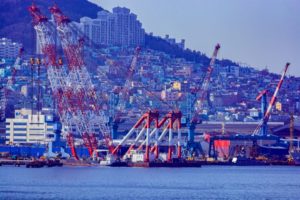 Giant floating crane in front of Busan Shipbuilding & Offshore Co., Ltd. shipyard on Geoje island in the Harbor of Busan, South Korea
