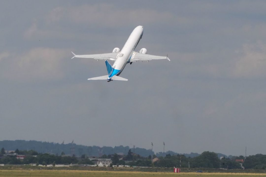 A BOEING 737-10 MAX AIRCRAFT TAKES OFF FROM AN AIRPORT.