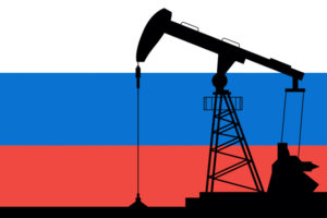A DRAWING OF A SILHOUETTE OF AN OIL PUMP SITS I FRONT OF THE RUSSIAN FLAG.