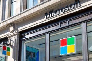 THE EXTERIOR OF A MICROSOFT STORE IN LONDON. THE MICROSOFT LOGO CAN BE SEEN IN THE WINDOW OF THE STORE.