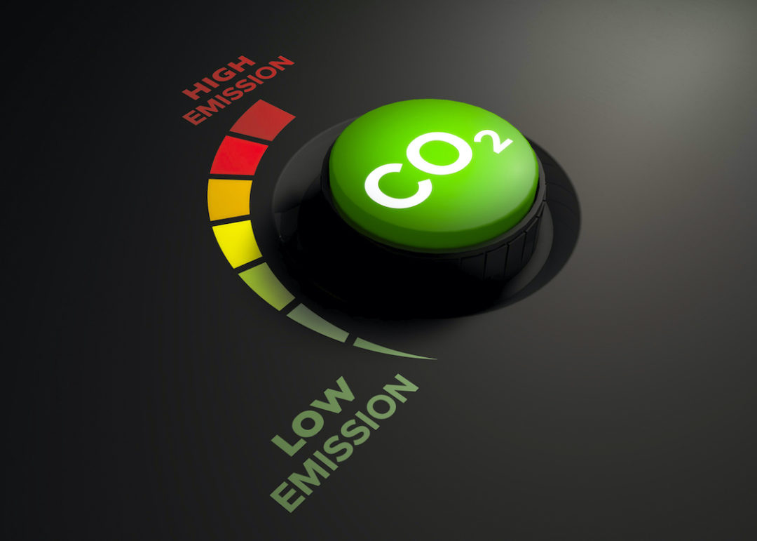 A DIAL THAT READS "CO2" SITS NEXT TO A METER THAT GOES FROM GREEN TO YELLOW TO ORANGE TO RED. NEXT TO THE GREEN BARS IS THE WORDS "LOW EMISSION" AT THE TOP OF THE METER, NEXT TO THE RED BAR, IT READS "HIGH EMISSION."