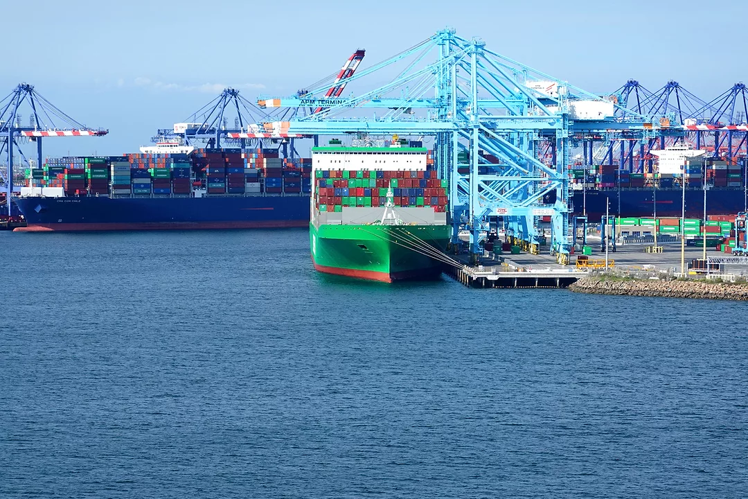A CONTAINER SHIP IS BEING UNLOADED AT THE PORT OF LOS ANGELES.