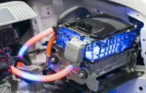 AN ELECTRIC VEHICLE LITHIUM BATTERY PACK IS CONNECTED TO A POWER SOURCE IN A CAR.
