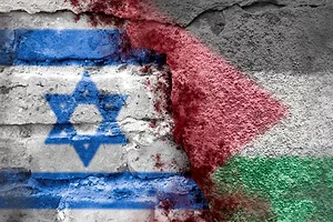 THE FLAG COLORS OF ISRAEL AND PALESTINE ARE SPRAY-PAINTED ON CRACKED CONCRETE
