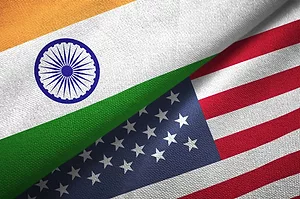 THE FLAGS OF THE US AND INDIA ARE FOLDED TO MEET