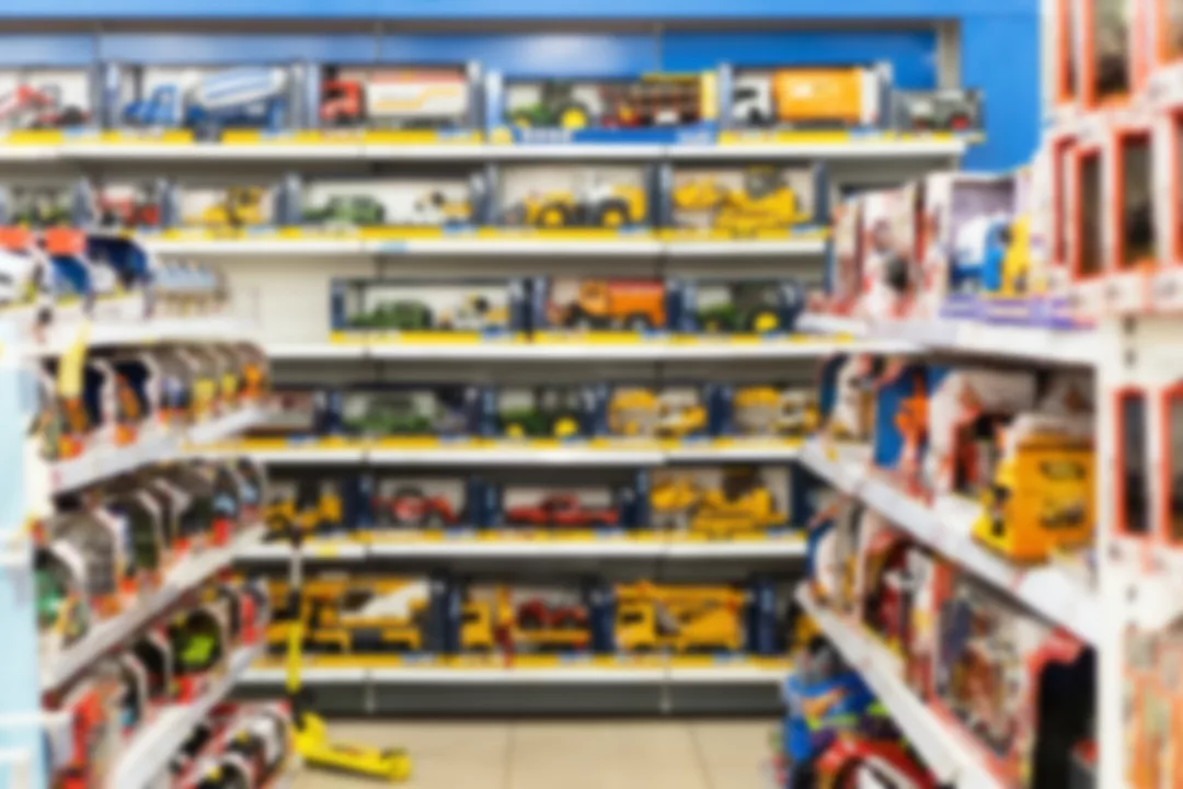 BLURRED IMAGE OF SHELVES IN A STORE FILLED WITH TOYS.