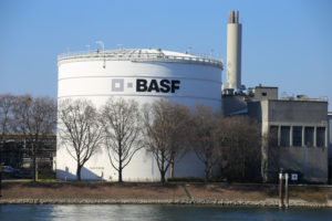 EXTERIOR VIEW OF A BASF CHEMICAL FACILITY BEHIND A FEW TREES.