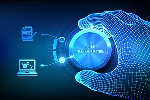 A VIRTUAL HAND ON A DIAL THAT READS "DIGITAL TRANSFORMATION." THE DIAL IS POINTING AT A GRAPHIC OF A LAPTOP BELOW A GRAPHIC OF A PEN AND PAPER.