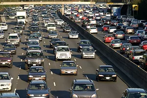A TRAFFIC JAM IS TAKING PLACE ON BOTH SIDES OF THE HIGHWAY.